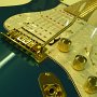 Gold Hardware with White Pearl Pickguard and Metallic Teal Body
